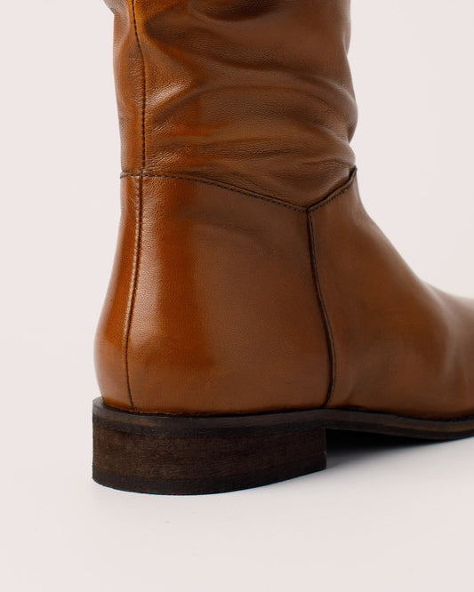 Detail of slouchy shaft design on Amy cognac leather boots