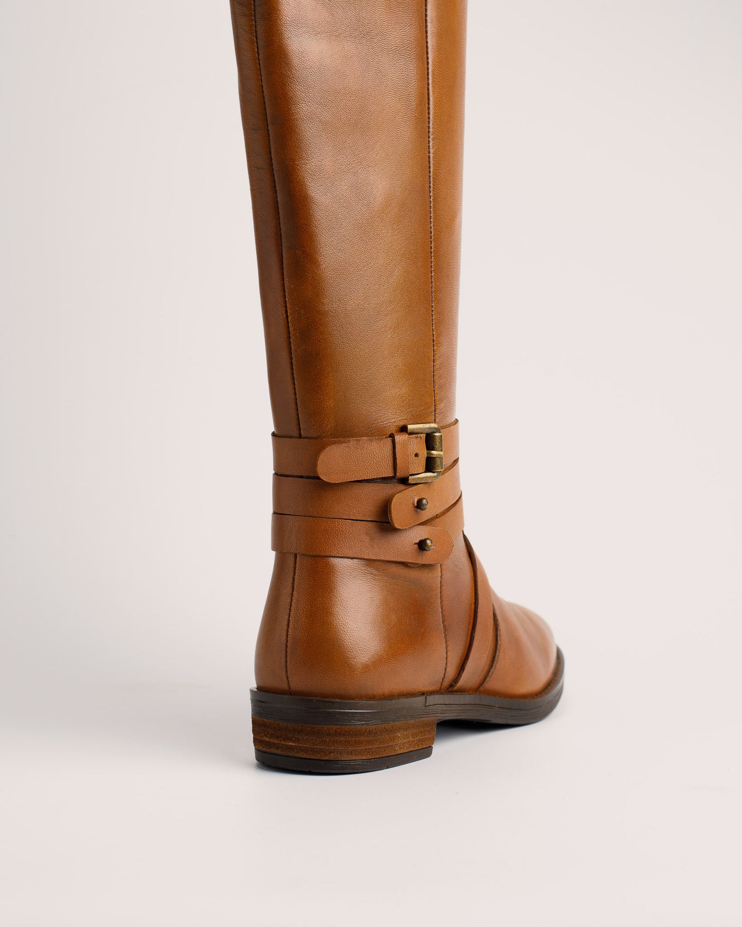 Side view of Babila cognac leather riding style boots with 38 cm shaft