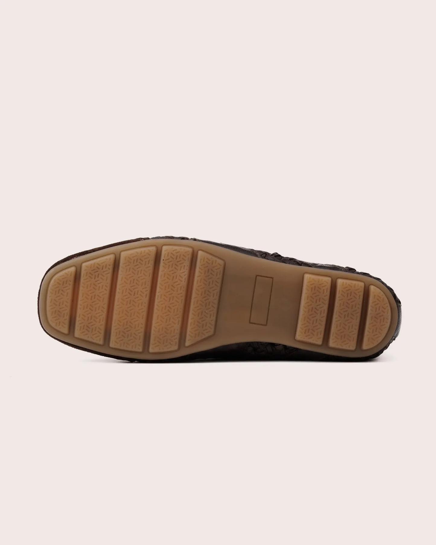 Dark brown woven leather sneaker outsole view
