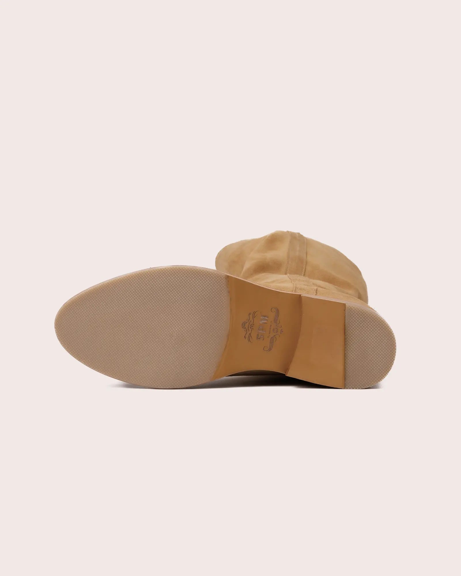 Beige suede ladies boot with inside wedge outsole view