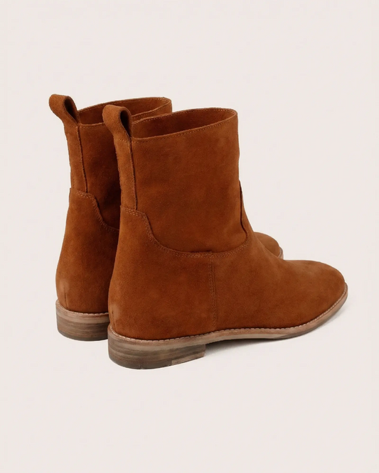 Tan suede ankle boot with inside wedge side view