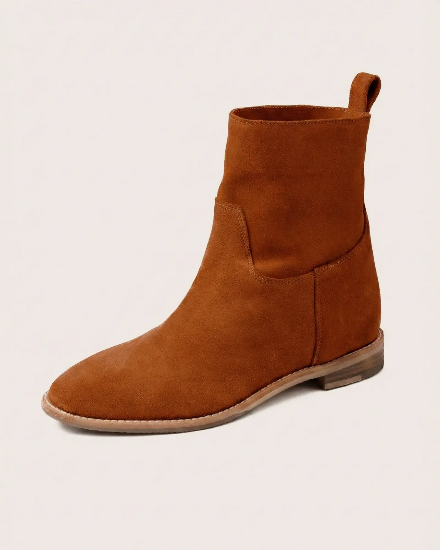Tan suede ankle boot with inside wedge side view