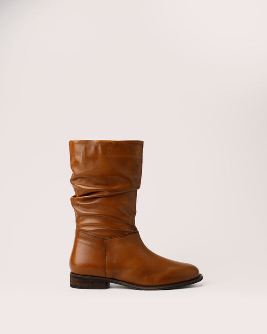 Side view of Amy cognac leather slouchy boots in genuine leather