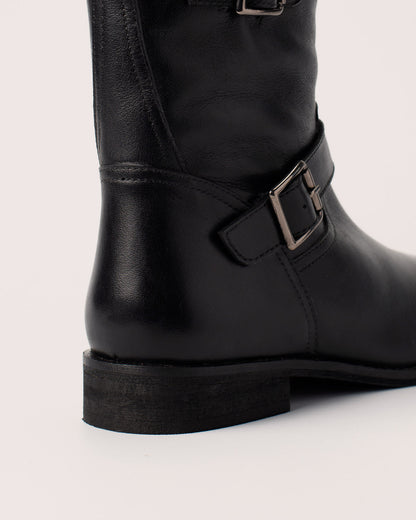 Side view of Lisa black leather ankle boots with double buckle details